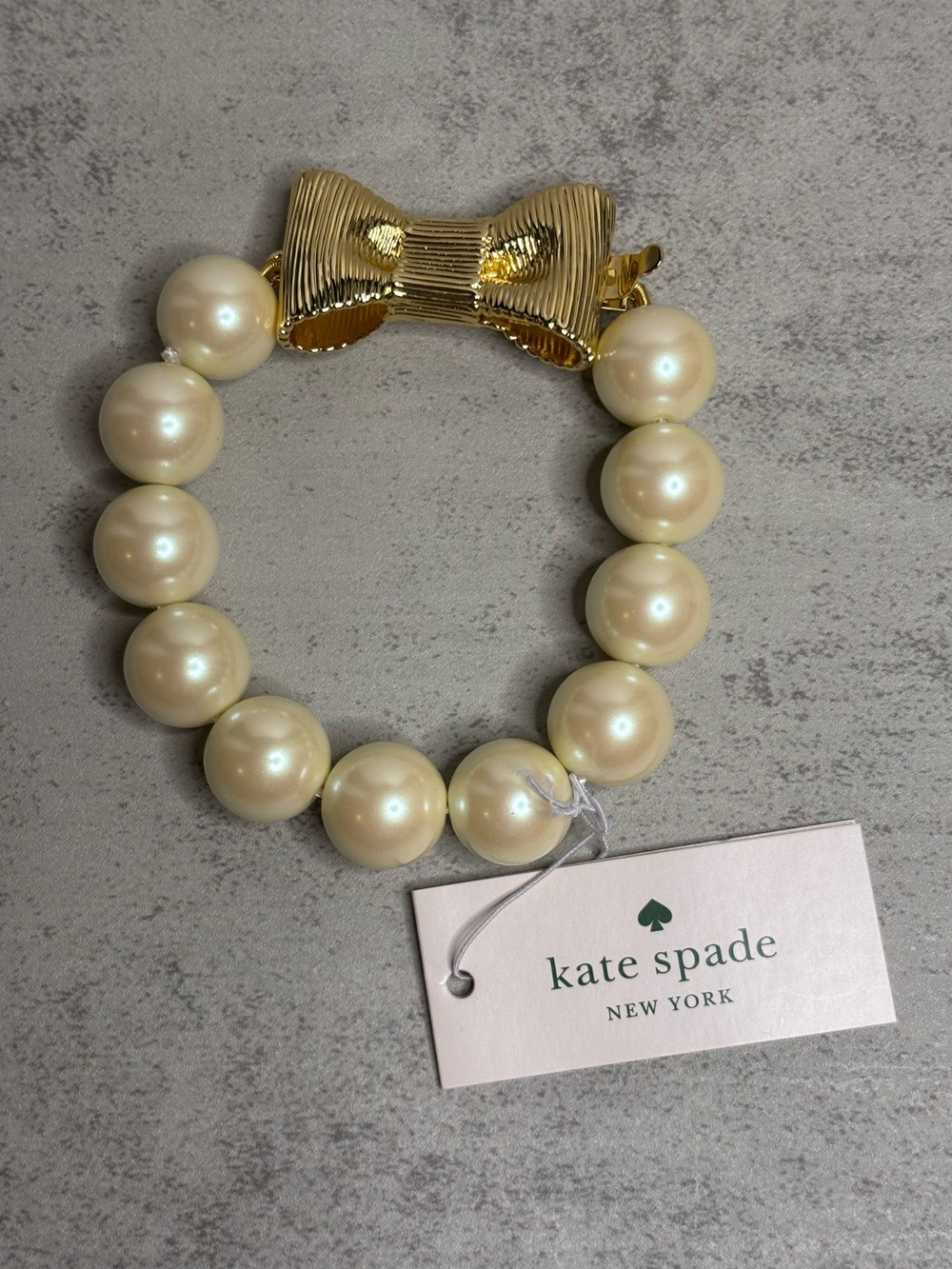Kate Spade All Wrapped Up Faux Pearl Bracelet with Gold Bow Closure - Picture 3 of 10